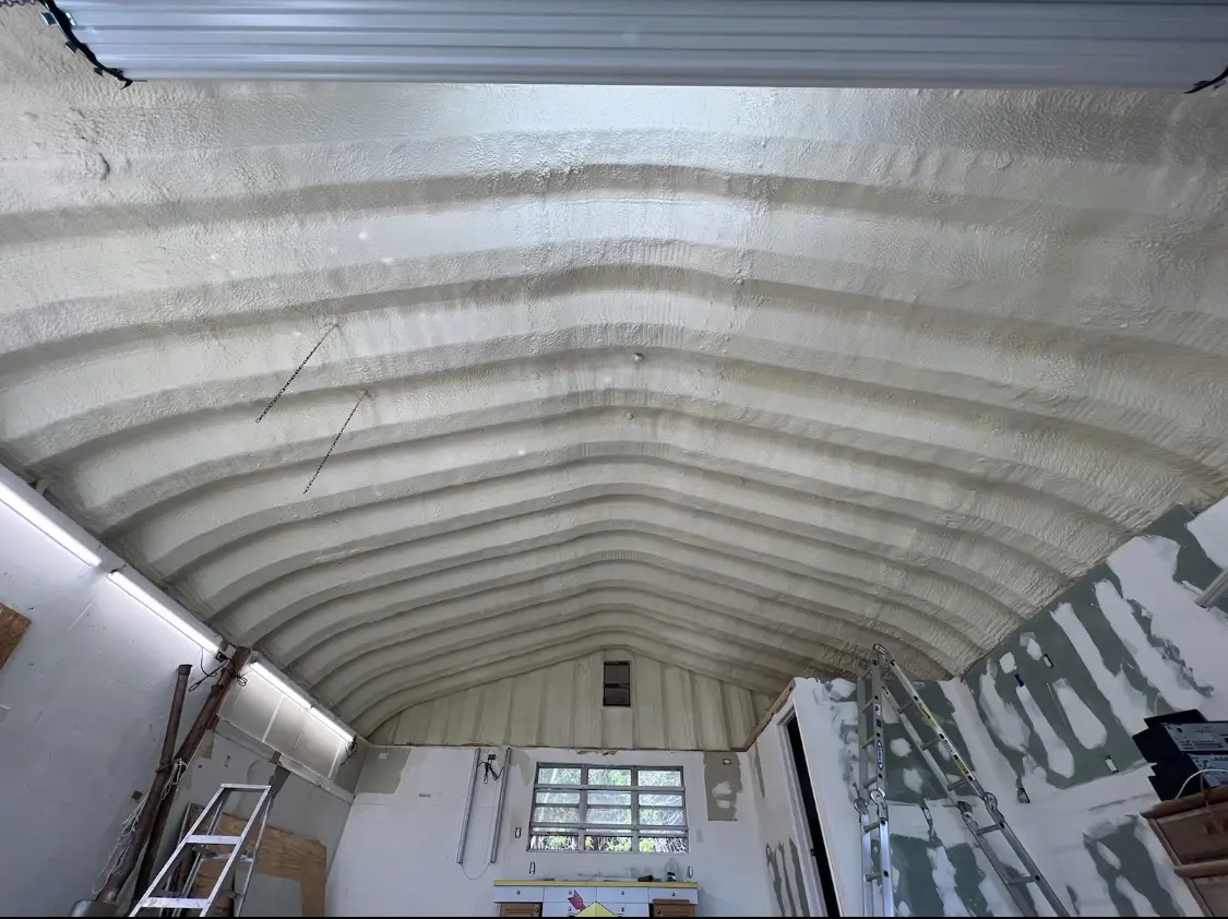 Spray polyurethane foam applied to the underside of a metal roof deck in Gun Plain